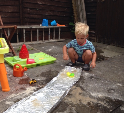 Foil boat toddler activity garden